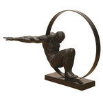 FIGURE OF A MAN IN A CIRCLE, METAL AND BLACK RESIN