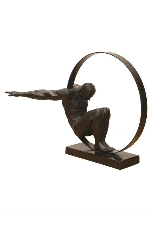 FIGURE OF A MAN IN A CIRCLE, METAL AND BLACK RESIN