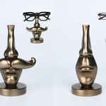 S/3X2 BROWN/GOLD RESIN GLASSES HOLDER 'FACE'